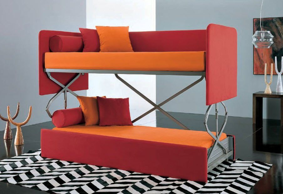 gorgeous-red-and-orange-couch-that-turn-into-bed-design-with-pillows-on-chevron-patterned-area-rug-in-gray-room